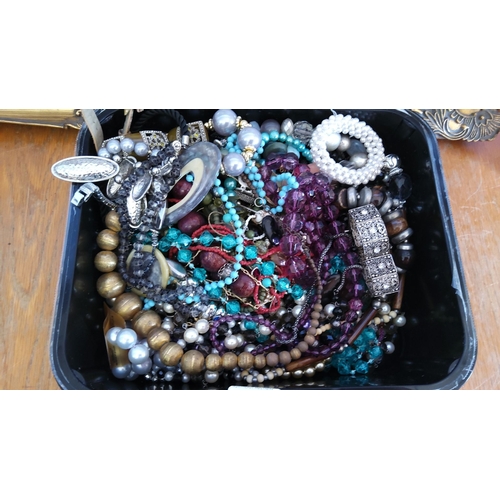 305 - Assortment of costume and beaded jewelry including necklaces, bracelets, and earrings featuring vari... 