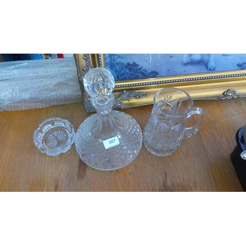 307 - Cut glass decanter set, consisting of a crystal decanter with stopper, a crystal mug, and a small di... 