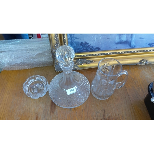 307 - Cut glass decanter set, consisting of a crystal decanter with stopper, a crystal mug, and a small di... 