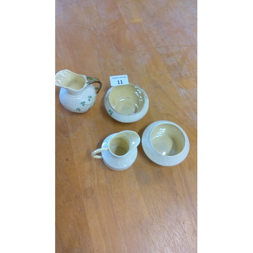 11 - Set of four Belleek Irish porcelain pieces, including two creamers and two bowls, featuring the trad... 