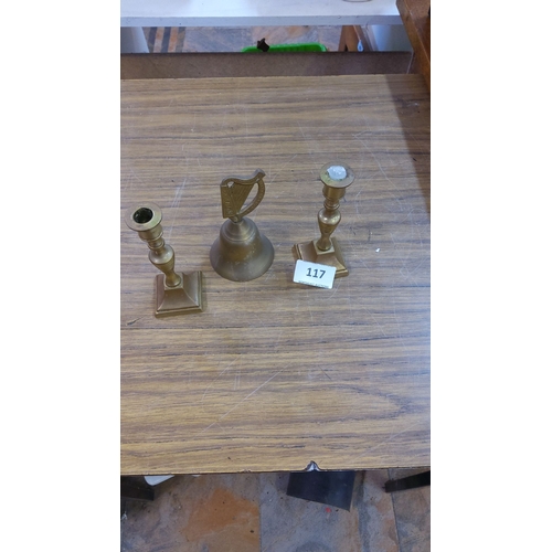 117 - Set of two vintage brass candlesticks and a brass bell with harp design.