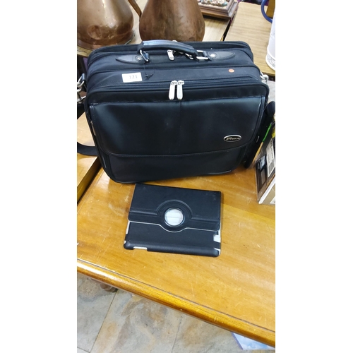 121 - Two items: Targus black laptop bag with multiple compartments and shoulder strap, and a black tablet... 