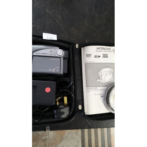 142 - Hitachi DVD Camcorder DZ-MV5000E in carrying case, includes charger, power cables, and user manual.