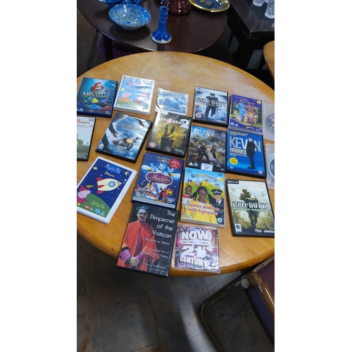 17 - Mixed lot of 17 assorted DVDs and CD. Includes Disney classics, programs, games, comedy specials, an... 