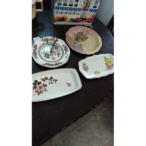 178 - Assorted decorative porcelain dishes, including two-tiered platters with floral designs. Features va... 