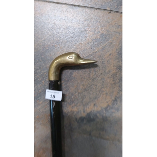 18 - Vintage walking cane with a brass bird head handle and a black wooden shaft. Distinctively shaped, f... 