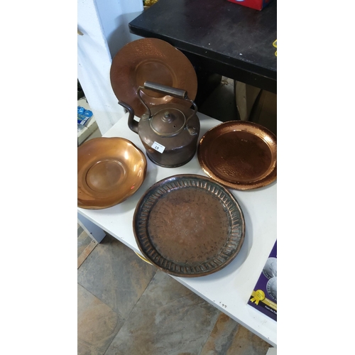 19 - Collection of five copper kitchenware items, including a kettle, two hammered trays, a round bowl, a... 