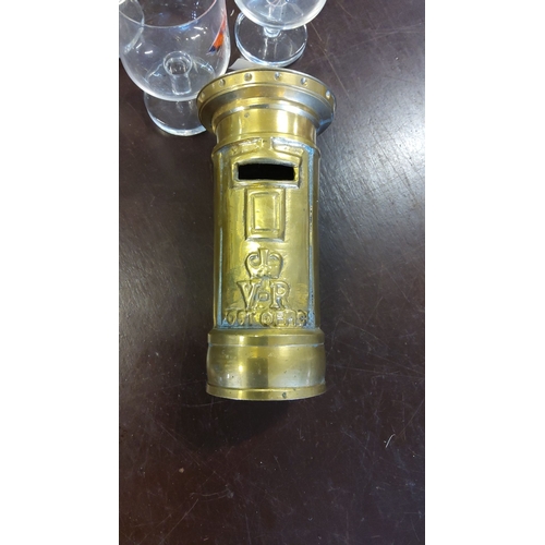 199 - Brass Victorian-style miniature post box money bank, with embossed VR royal cypher. Height: 8 inches... 