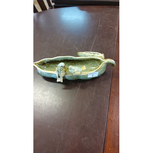 2 - Ceramic dish featuring two bird figures, glazed in green tones. Dimensions: 12 inches in length.