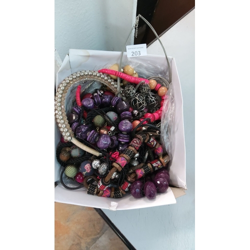 203 - Mixed lot of assorted jewelry including multi-colored beaded necklaces, intricate wirework pieces, a... 