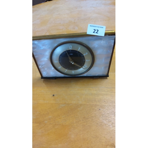 22 - Vintage Metamec mantle clock, features a pearl-tone face with black and gold accents. Made in Englan... 