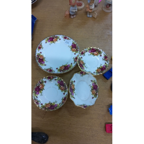 235 - Set of four old country rose china pieces with vibrant floral patterns and gold trim, featuring desi... 