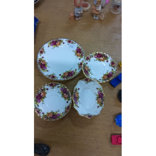 235 - Set of four old country rose china pieces with vibrant floral patterns and gold trim, featuring desi... 