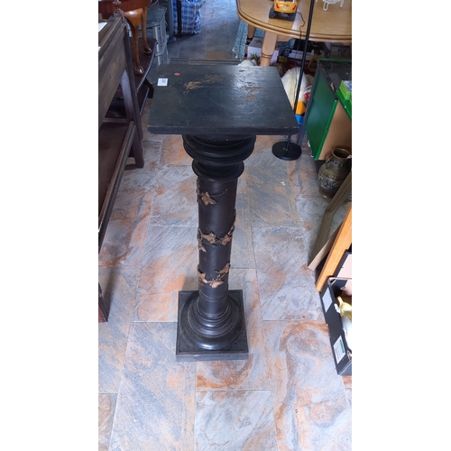 260 - Victorian-style black pedestal column with decorative gold accents. Durable, ornate, and elegant.