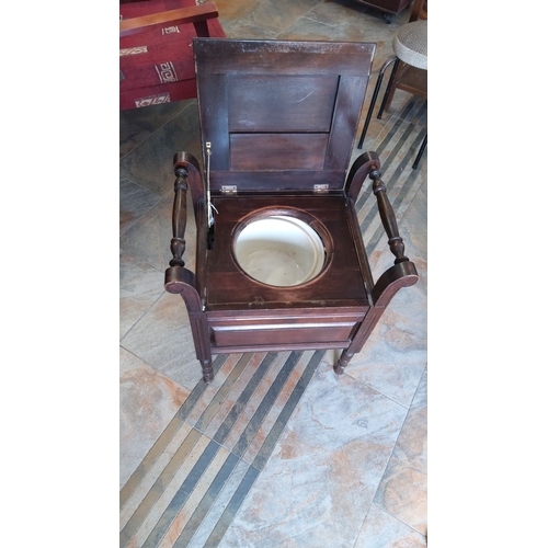 274 - Antique Victorian mahogany commode chair with turned arm supports and original ceramic chamber pot, ... 