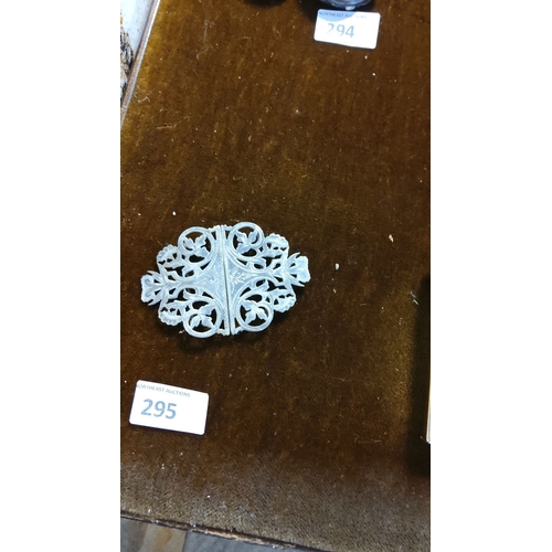 295 - Antique silver plated filigree brooch with intricate floral motifs. From the Victorian era.