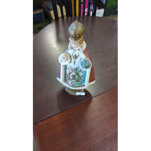 3 - Hand-painted ceramic figurine depicting the Infant Jesus of Prague, adorned in ornate ceremonial rob... 