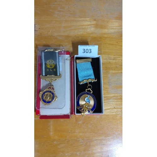 303 - Set of two ceremonial Masonic medals with enameled insignia. Includes badges from the Grand Lodge of... 