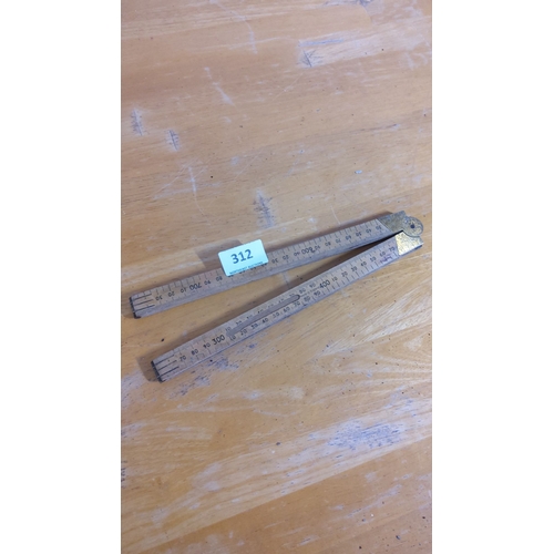 312 - Vintage folding wooden ruler with brass fittings, marked with centimeter and millimeter measurements... 