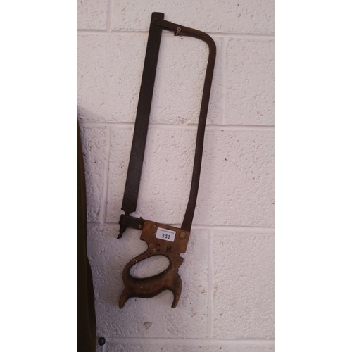 341 - Vintage carpenter's bowsaw with wooden handle and steel frame. Features 