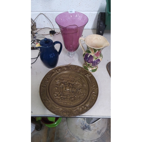 360 - This collection includes a decorative brass plate with an embossed scene, a purple glass vase, a blu... 