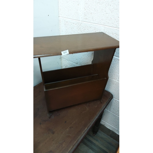 372 - Vintage wooden magazine rack with shelf, from the mid-20th century. Features a dark wood finish and ... 