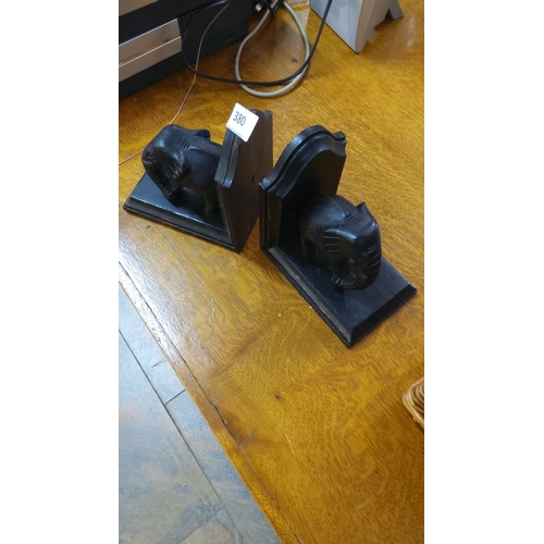 380 - Pair of black wooden elephant bookends.