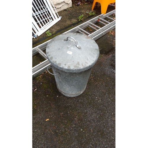 390 - Galvanized metal trash can with lid and handles.