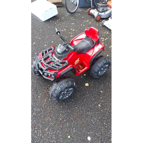 410 - Red ride-on ATV with number 95 decals, featuring a durable black plastic framework and large rugged ... 