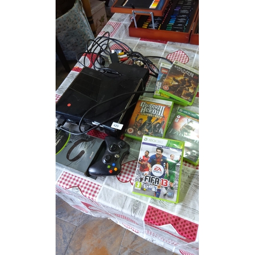 429 - Xbox 360 gaming console includes a power adapter, one controller, and six games: FIFA 13, Guitar Her... 