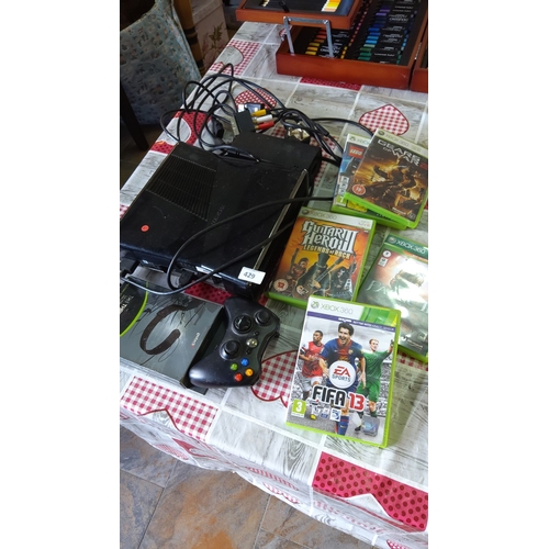 429 - Xbox 360 gaming console includes a power adapter, one controller, and six games: FIFA 13, Guitar Her... 