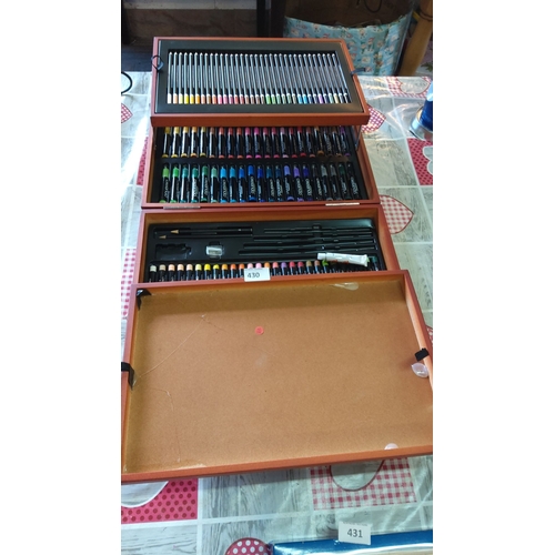 430 - Wooden artist's case contains assorted colored pencils, markers, oil pastels, and additional art sup... 