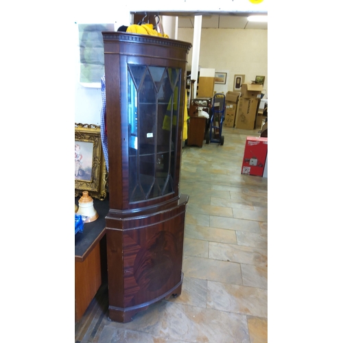 448 - Mahogany corner display cabinet with glass door, upper shelves, and lower storage compartment, featu... 