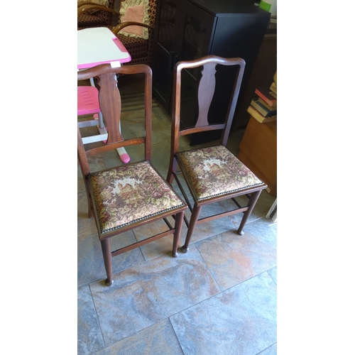 449 - Pair of Victorian-style wooden chairs with embroidered tapestry seats featuring a pastoral scene.