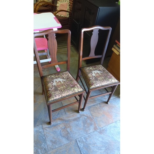 449 - Pair of Victorian-style wooden chairs with embroidered tapestry seats featuring a pastoral scene.