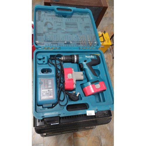 460 - Makita cordless drill set includes charger, battery packs, and drill bits in a blue carrying case. M... 