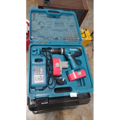 460 - Makita cordless drill set includes charger, battery packs, and drill bits in a blue carrying case. M... 