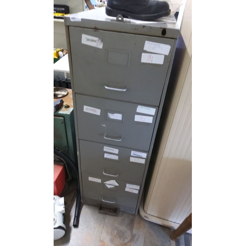 485 - Four-drawer metal filing cabinet, gray. Includes various labels on drawers.