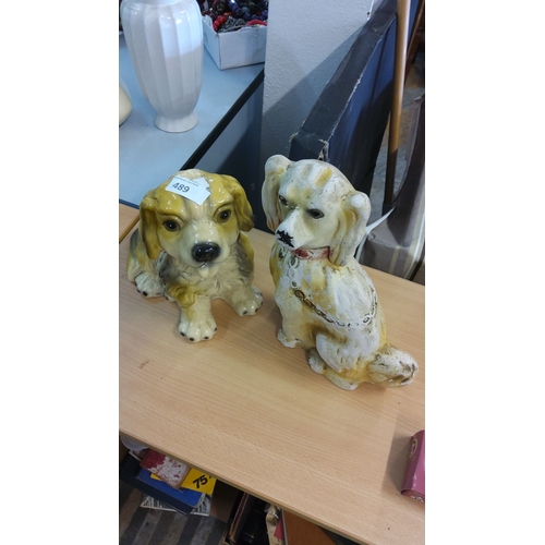 489 - 2 ceramic dog figurines, featuring a seated spaniel and a playful puppy. Hand-painted details.