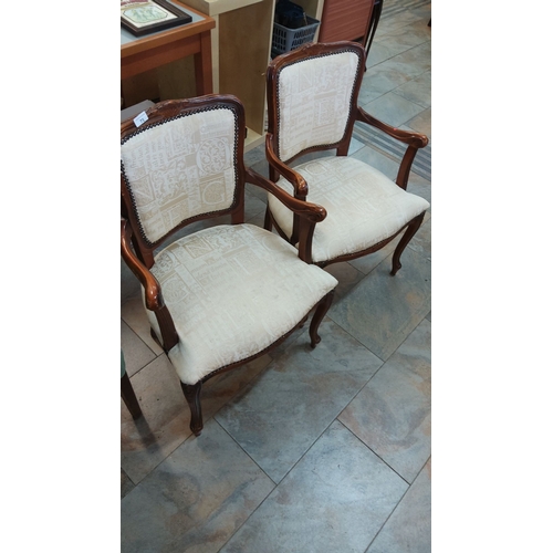 71 - Pair of Louis XV-style armchairs with carved wood frames and upholstered seats. Features intricate d... 