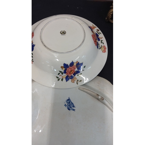 77 - Set of two vintage ceramic dishes: one features a floral motif by 