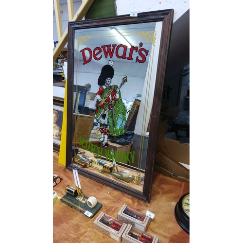 87 - Vintage Dewar's Scotch Whisky mirror with a wooden frame, featuring a colorful illustration of a Hig... 