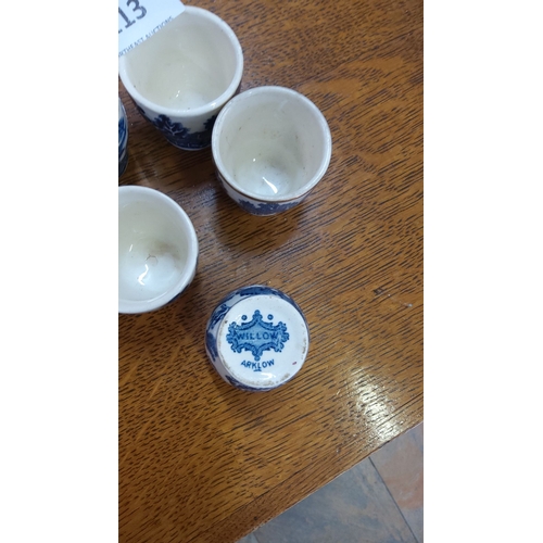 113 - Set of five Arklow Willow pattern ceramic egg cups, featuring a traditional blue and white design.