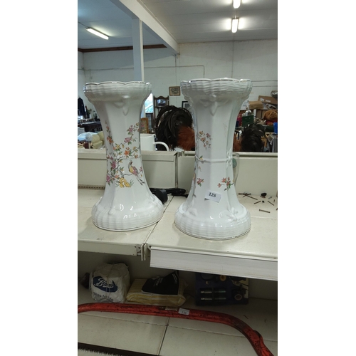 128 - Pair of vintage white porcelain plant stands decorated with floral patterns and birds.