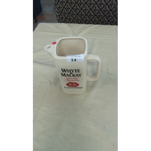 14 - Cream-colored ceramic pub water jug with black and red lettering.