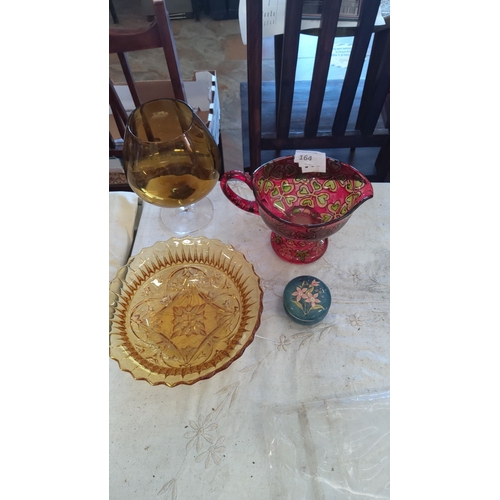 164 - Mixed lot of four glass and ceramic items: amber glass bowl and goblet, hand-painted ceramic jug, an... 