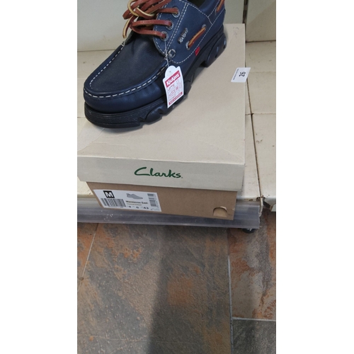 26 - Clarks Wavescree East shoes, size 43, complemented with brown Kickers laces, displayed in original p... 