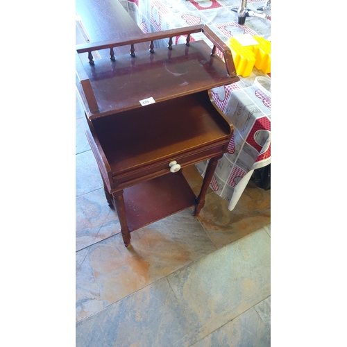 425 - Antique mahogany side table with single drawer featuring porcelain knobs, mid-section shelf, and spi... 