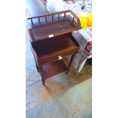 425 - Antique mahogany side table with single drawer featuring porcelain knobs, mid-section shelf, and spi... 