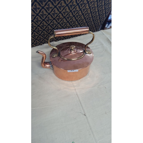 43 - Antique copper kettle with brass accents, featuring a swan neck spout and curved handle.